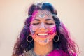 Holi Festival Of Colours. Portrait of happy indian girl in traditional hindu sari on holi color . india woman silver Royalty Free Stock Photo