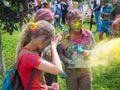 Holi festival in Russia. Gatchina. In the summer 2017. Young color girl and boy on Holi color festival in Saint-Petersburg.