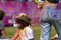 Holi festival in St. Kilda, Australia: girl with dirty jeans