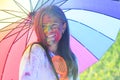 Holi girl with umbrella. children with creative body art. Happy youth party. Optimist. Spring vibes. positive and