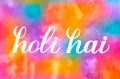 Holi hai calligraphy hand lettering on colorful watercolor background. Indian Traditional festival of colors. Hindu spring Royalty Free Stock Photo