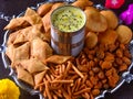 Holi snack platter with thandai