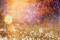 holiday abstract glitter background with blinking stars and falling snowflakes. Blurred bokeh of Christmas lights Royalty Free Stock Photo