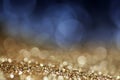 holiday abstract glitter background with blinking stars and falling snowflakes. Blurred bokeh of Christmas lights Royalty Free Stock Photo