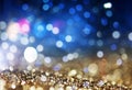 holiday abstract glitter background with blinking stars and falling snowflakes. Blurred bokeh of Christmas lights Royalty Free Stock Photo