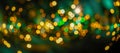 Holiday Abstract shiny green and gold bokeh and glitter for invitation. green and golden bokeh background Royalty Free Stock Photo