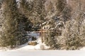 Holiday apartment in winter - wooden cottage in forest on the lake in Quebec