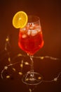 holiday aperitif with string lihgts and orange slice Royalty Free Stock Photo