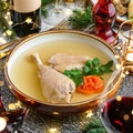 Holiday aspic or galantine with chicken in plate on wooden table served with plates, glasses, bottle of wine, candles, fir Royalty Free Stock Photo