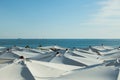 White umbrellas in the beach in blue clear sky background Royalty Free Stock Photo