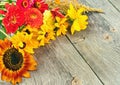 Holiday autumn bouquet. Frame of colorful flowers arranged on old wooden background. Royalty Free Stock Photo