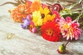 Holiday autumn bouquet. Frame of colorful flowers arranged on old wooden background. Royalty Free Stock Photo