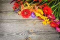 Holiday autumn bouquet. Frame of colorful flowers arranged on old wooden background. Royalty Free Stock Photo