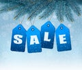 Holiday background with blue sale tags.