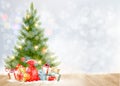 Holiday background with a Christmas tree and presents. Royalty Free Stock Photo