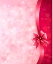 Holiday background with gift pink bow and ribbon.