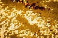 Background from gold glitter paillettes, close up. Metallic Glitter background , Golden sequins, sparkling sequined textile Royalty Free Stock Photo