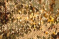 Background from gold glitter paillettes, close up. Metallic Glitter background , Golden sequins, sparkling sequined textile Royalty Free Stock Photo