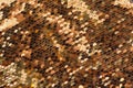 Background from gold glitter paillettes, close up. Metallic Glitter background , Golden sequins, sparkling sequined textile