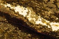 Background from gold glitter paillettes, close up. Metallic Glitter background , Golden sequins, sparkling sequined textile Royalty Free Stock Photo