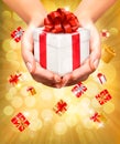 Holiday background with hands holding gift boxes. Royalty Free Stock Photo