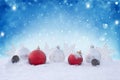 Holiday background with red Christmas balls, snowflakes and  cones. Winter Scene. New Year greeting card. Christmas decorations on Royalty Free Stock Photo