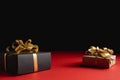 Various handmade gift boxes on red and black background. Minimal style and valentines day concept. Royalty Free Stock Photo