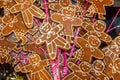 Holiday background - wooden gingerbread men on candycane sticks all piled up on each other - selective focus on foreground with