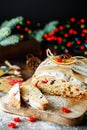 Holiday baking. Christmas cake. Stollen is fruit bread of nuts, spices, dried or candied fruit, coated with powdered sugar. It is Royalty Free Stock Photo