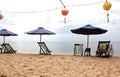 Holiday beach chairs umbrellas lanterns Royalty Free Stock Photo