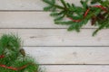 Holiday border of greenery in the upper right and lower left cor Royalty Free Stock Photo