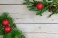 Holiday border of greenery in the upper right and lower left cor Royalty Free Stock Photo