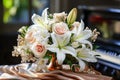 Holiday bouquet of pink roses and white lilies near grand piano