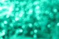 Holiday bright trendy mint lights bokeh background.