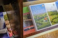 Holiday brochures and travel guides seen stacked on a shelf. Royalty Free Stock Photo