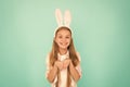 Holiday bunny girl posing with cute long ears. Child smiling play bunny role. Happy childhood. Traditions for kids to