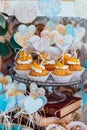 Holiday candy bar. Cupcakes with cream and fruits decorated with hearts