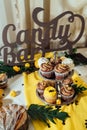Holiday candy bar. Candy bar served with cupcakes with chocolate and lemon cream