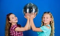 Holiday celebration. Entertainment concept. Sisters friends with disco ball. Lets start party. Cheerful kids hold disco