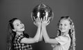 Holiday celebration. Entertainment concept. Sisters friends with disco ball. Lets start party. Cheerful kids hold disco