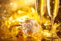 Holiday Champagne Flute over Golden glow background. Christmas and New Year celebration. Two Flutes with Sparkling Wine Royalty Free Stock Photo
