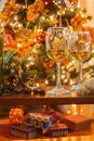Wine glasses with Christmas tree and presents Royalty Free Stock Photo