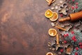 Holiday christmas background for baking cookies with cutters, rolling pin and spices on brown table top view. Copy space for text. Royalty Free Stock Photo