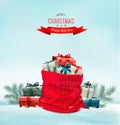 Holiday Christmas background with a sack full of gift boxes. Royalty Free Stock Photo