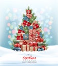 Holiday Christmas background with Christmas tree made out of colorful gift boxes and presents. Royalty Free Stock Photo