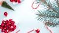 Holiday Christmas background. White gift box with red ribbon, New Year balls and winter tree in xmas composition on white for Royalty Free Stock Photo