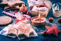 Holiday Christmas Gifts with Boxes, Candle and gingerbread cookies on dark blue Royalty Free Stock Photo
