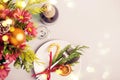 Holiday Christmas table setting. Winter bouquet, natural decoration and bokeh lights Royalty Free Stock Photo