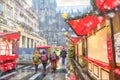 Holiday cityscape - view of the Christmas Market Weihnachtsmarkt early morning on background the Cologne Cathedral