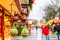 Holiday cityscape - view of souvenir metal birds with feed on background of the Christmas Market Weihnachtsmarkt